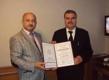 BATTAM Başkanı Özkan Hüseyin’e fahri proseförlük ünvanı verildi